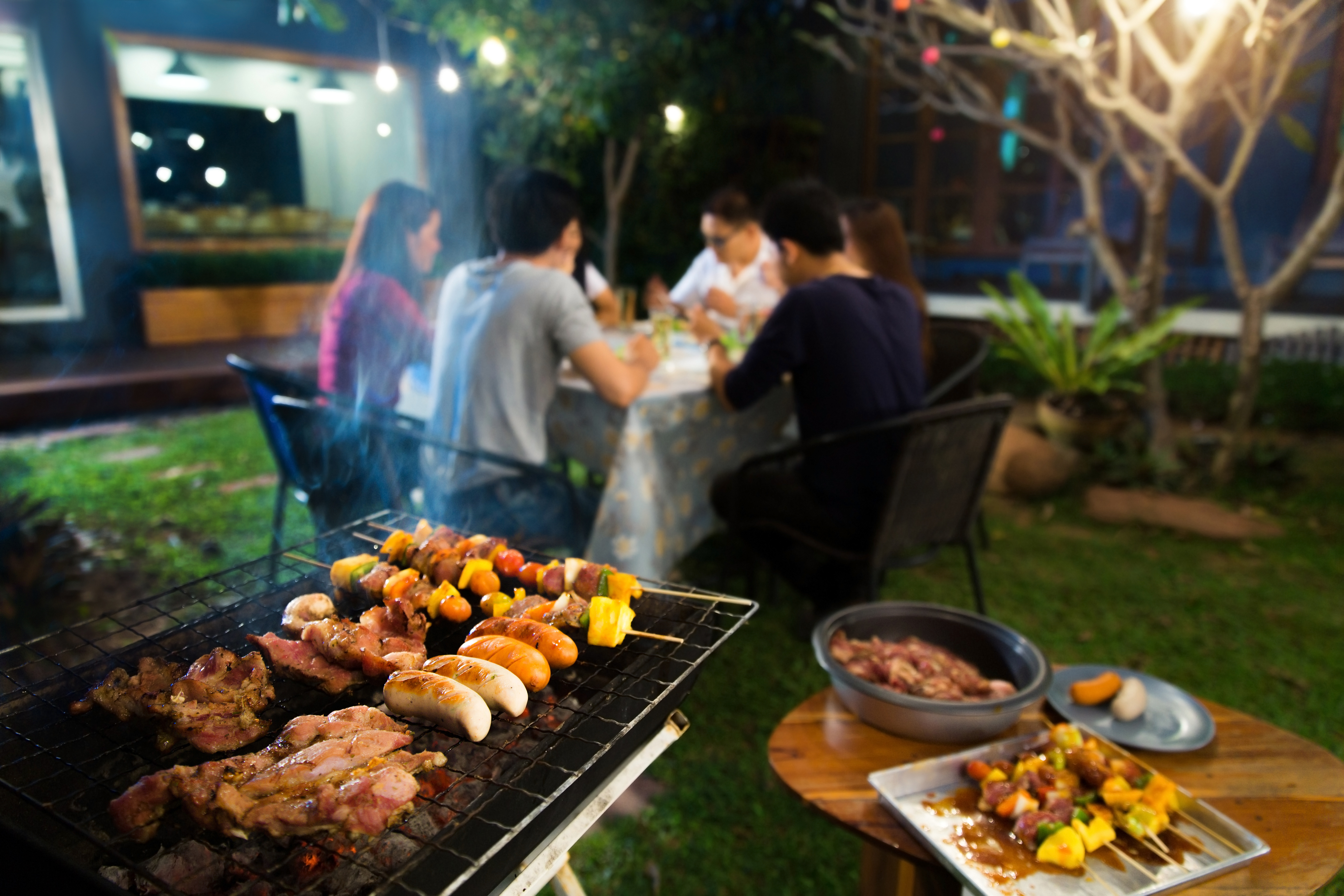 Dinner party, barbecue and roast pork at night